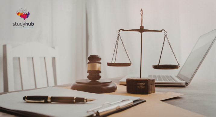 A judge's gavel, scales of justice, and legal documents on a desk in a professional setting.