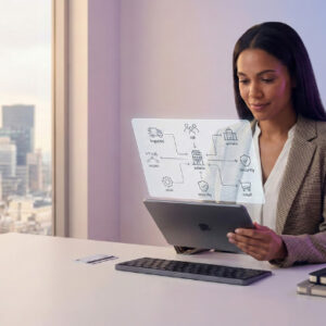 Senior business operations manager reviewing strategic plans on a tablet in a modern corporate office.