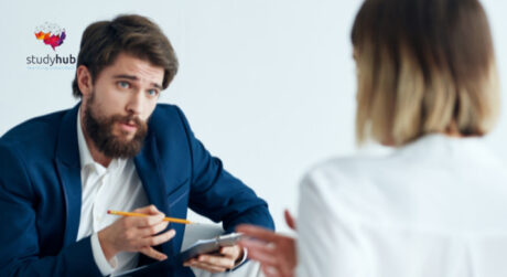 Professional recruiter interviewing a job candidate during a one-to-one meeting in a modern office.