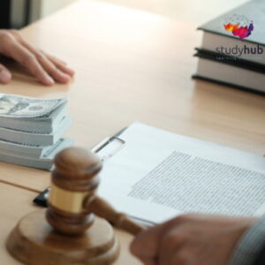 Close-up of a contract signing process with a gavel and money on a desk.