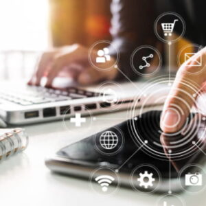 Person interacting with a smartphone while using a laptop, surrounded by digital icons symbolizing technology, communication, and connectivity.