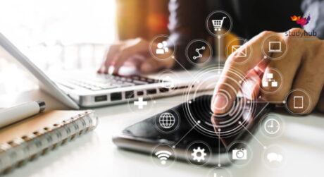 Person interacting with a smartphone while using a laptop, surrounded by digital icons symbolizing technology, communication, and connectivity.