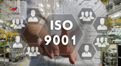 Digital ISO 9001 Quality Management System interface with team icons overlaying a factory background.