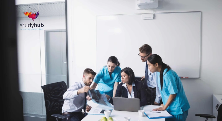 Healthcare professionals and administrators reviewing medical records and scans in a collaborative meeting, representing the Consent Training in Healthcare Course