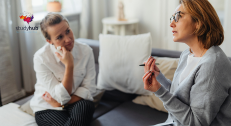Therapist counseling a client during a one-on-one session in a calm and professional office setting.