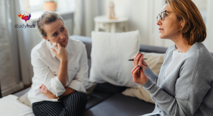 Therapist counseling a client during a one-on-one session in a calm and professional office setting.